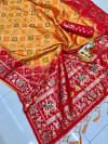 Mustard yellow and red color bandhani printed saree with golden zari weaving work
