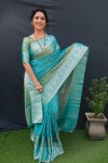 Firoji color soft muslin silk saree with woven work