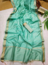 Sea green color soft linen saree with zari weaving work