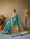 Rama green color leheriya silk saree with golden zari woven work