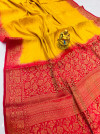 Yellow color pure muslin silk saree with golden zari woven work
