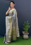 Gray color soft muslin silk saree with woven work
