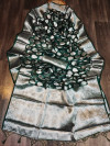 Dark green color organza silk saree with silver zari weaving butti
