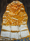 Yellow color organza silk saree with silver zari weaving butti