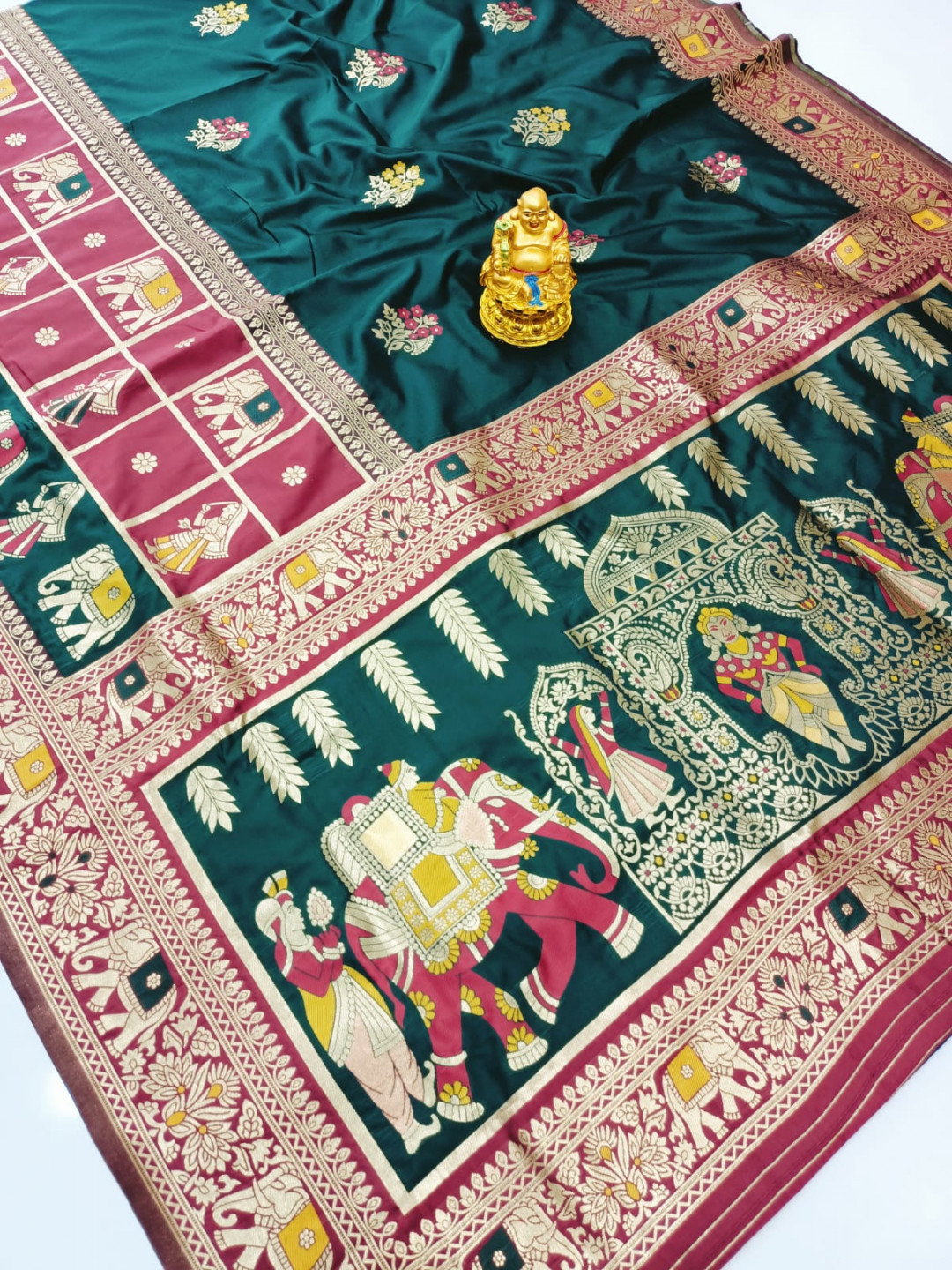 Dark green color paithani silk saree with zari weaving work
