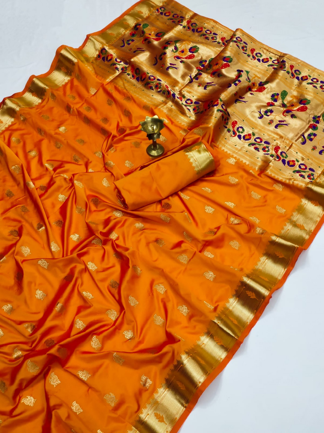 Orange color paithani silk saree with zari weaving work