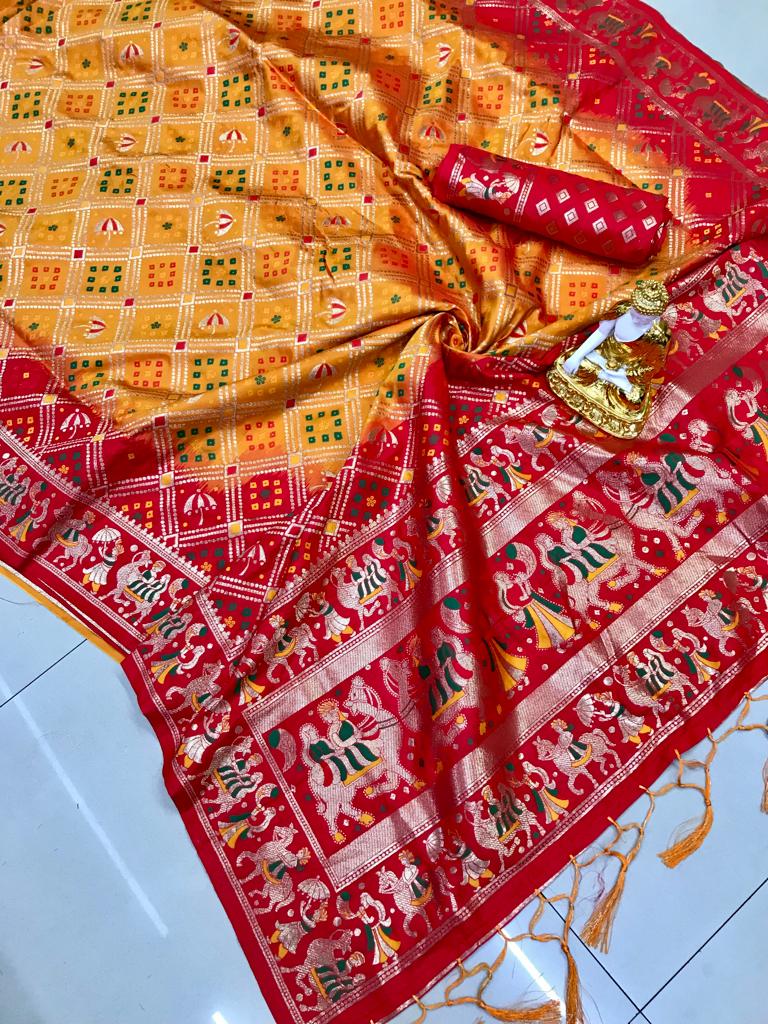 Mustard yellow and red color bandhani printed saree with golden zari weaving work
