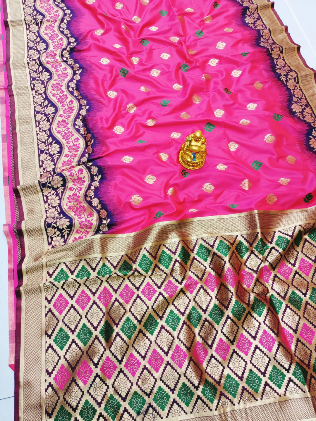 Rani pink color paithani silk saree with zari weaving work