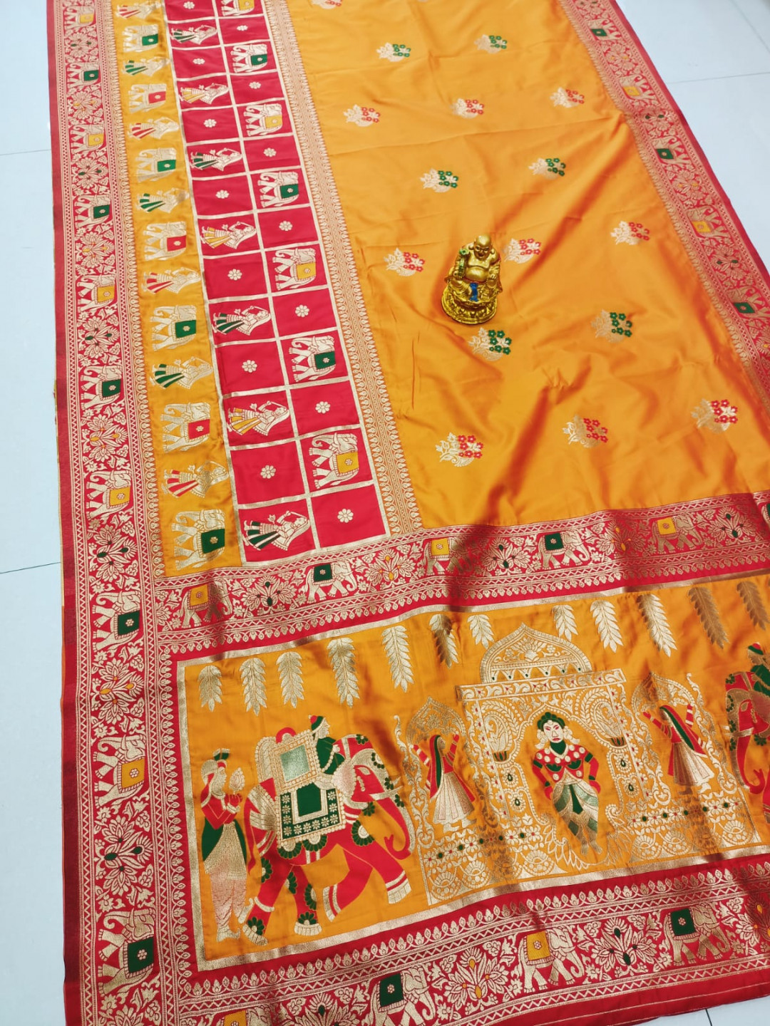 Orange color paithani silk saree with zari weaving work