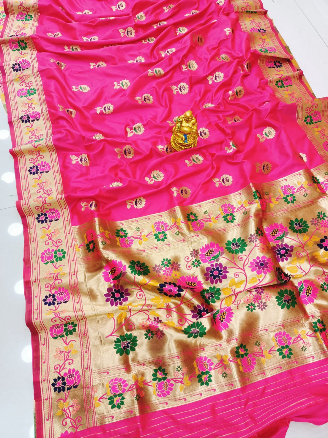 Rani pink color paithani silk saree with zari weaving work
