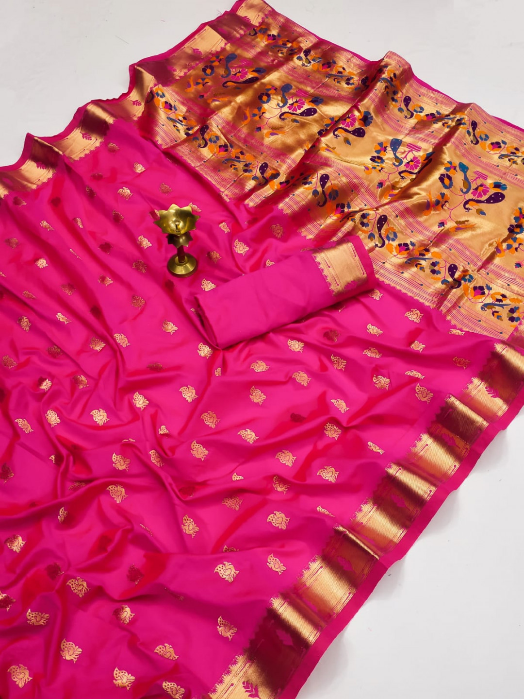 Rani pink color paithani silk saree with zari weaving work