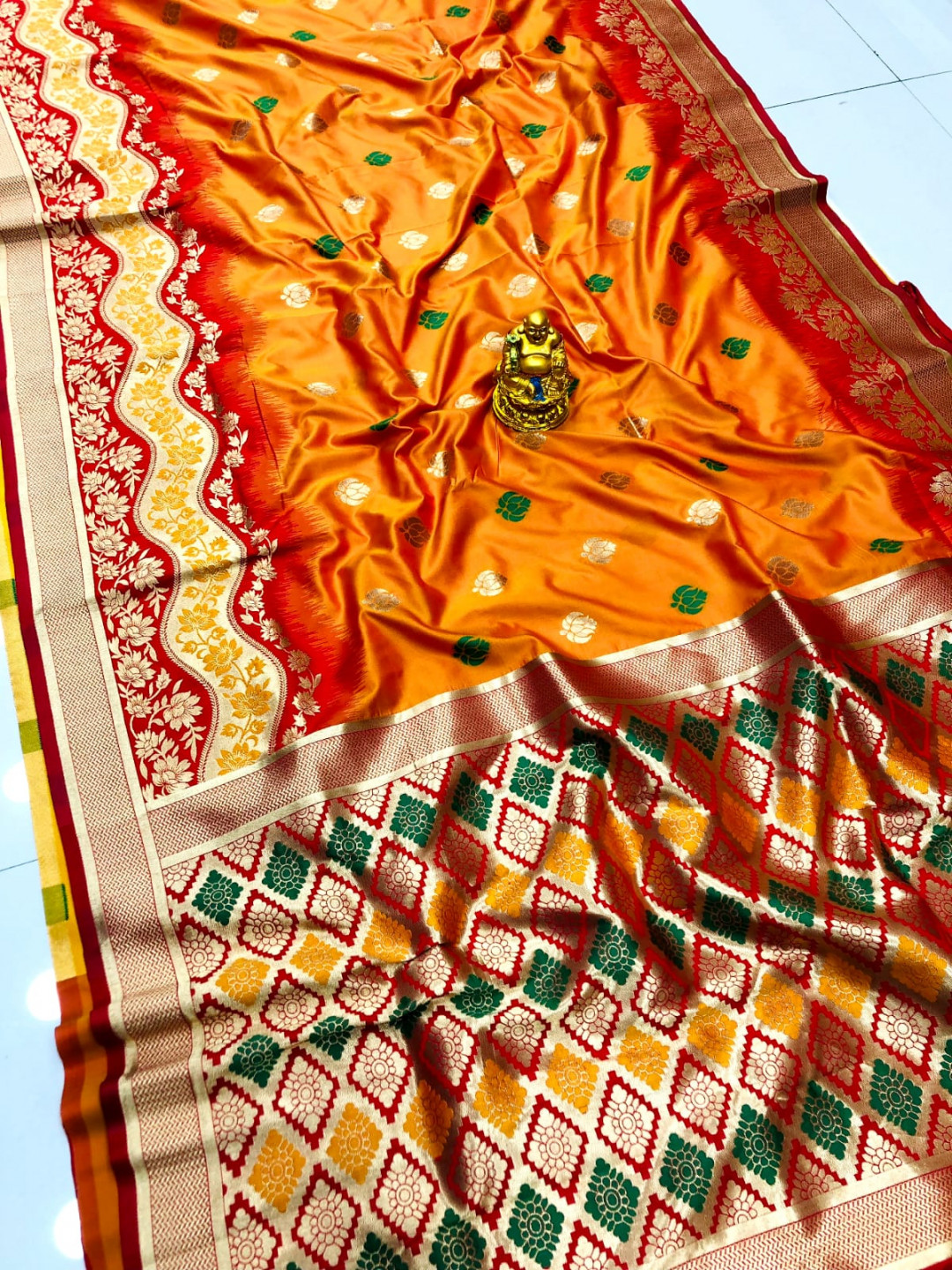 Orange color paithani silk saree with zari weaving work