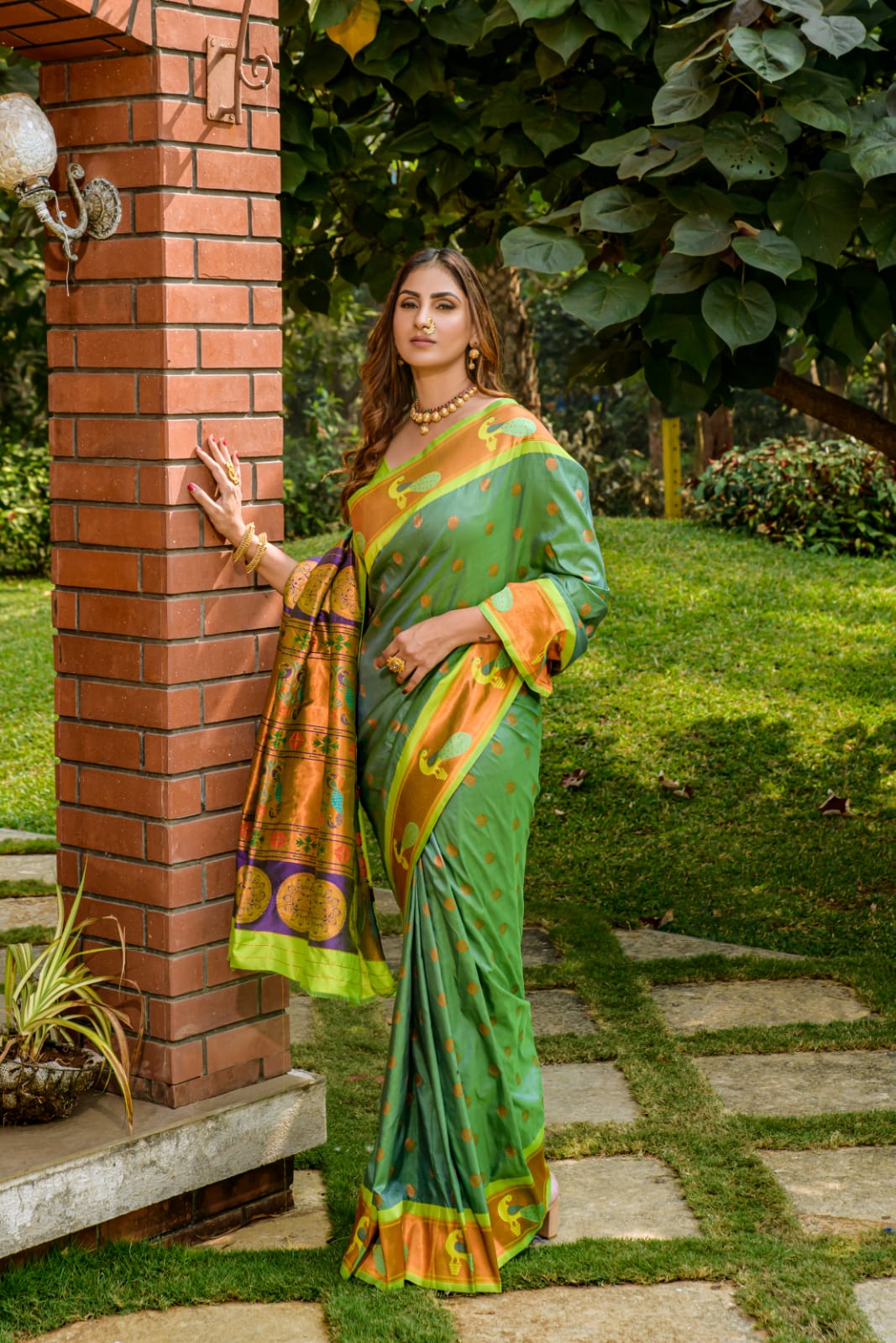 Green color paithani silk saree with zari weaving work