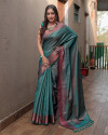 Rama green color soft fancy silk saree with zari woven work