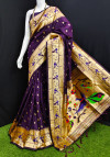 Magenta color paithani silk saree with zari weaving work