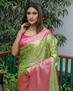 Parrot green color kanchipuram silk saree with zari woven work