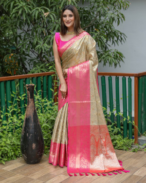Beige color kanchipuram silk saree with zari woven work