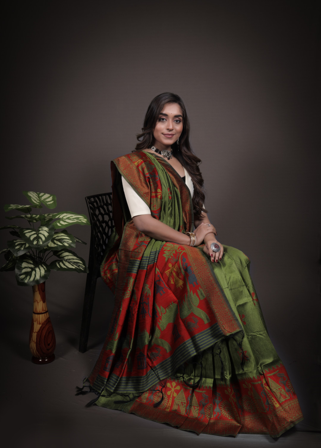 Mahendi green color handloom raw silk saree with zari woven work