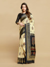 Cream and navy blue color soft jacquard silk saree with foil printed work