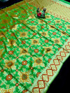 Parrot green color patola silk saree with woven design