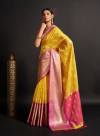 Yellow color organza silk saree with woven design