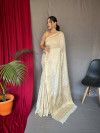 Off white color muslin silk saree with zari weaving work