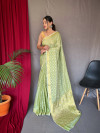 Pista green color muslin silk saree with zari weaving work