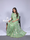 Pista green color soft georgette saree with zari weaving work