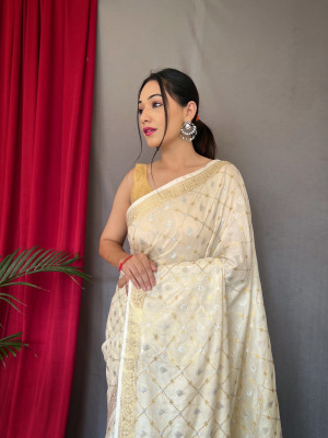 Off white color muslin silk saree with zari weaving work