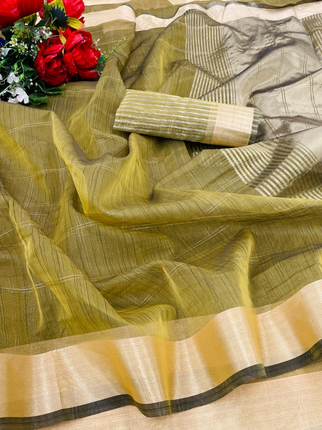 Mahendi green color organza silk saree with zari weaving work