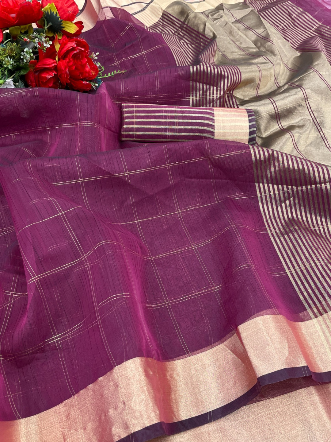 Magenta color organza silk saree with zari weaving work