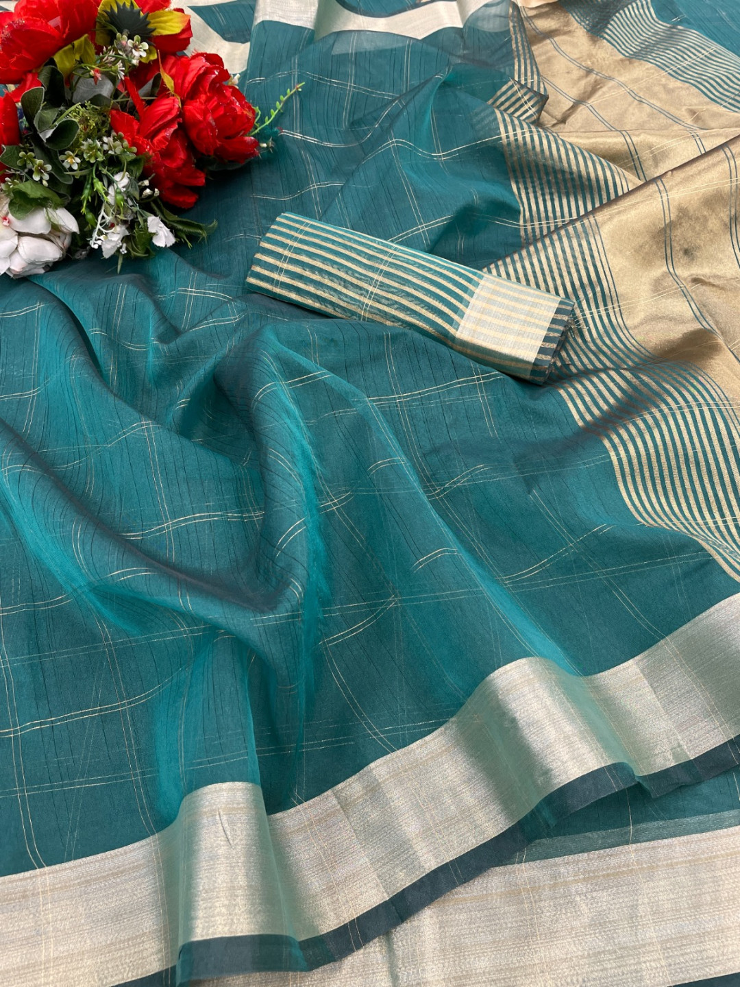 Rama green color organza silk saree with zari weaving work