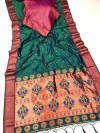 Dark rama green color paithani silk saree with zari weaving work