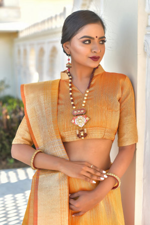 Orange color tassar silk weaving saree with silver and golden zari work