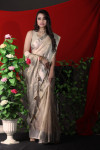 Off white color organza silk saree with zari weaving border