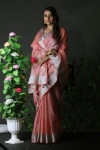 Peach color organza silk saree with zari weaving border