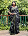 Black color pure hand bandhej silk saree with printed work
