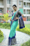 Sea green and blue color bandhej silk saree with zari weaving work