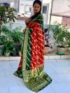 Red and bottle green color soft art silk saree with zari weaving work