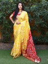 Yellow color bandhej silk saree with zari weaving work