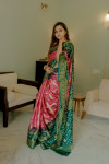 Pink and green color bandhej silk saree with zari weaving work