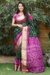 Green and magenta color bandhej silk saree with zari weaving work