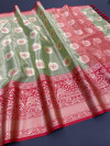 Pista green color tissue silk saree with zari weaving work