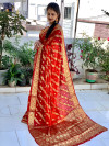 Orange and maroon color soft art silk saree with zari weaving work