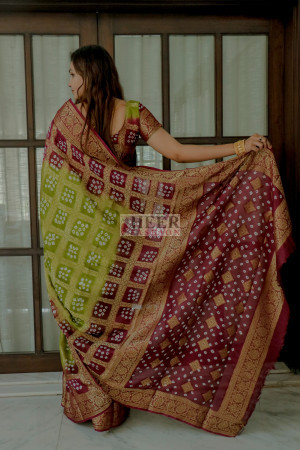 Mahendi green and magenta color bandhej silk saree with zari weaving work