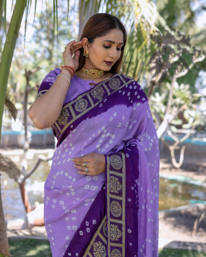 Purple color hand  bandhej silk saree with zari weaving work
