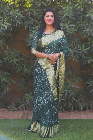 Bottle green color bandhej silk saree with printed work