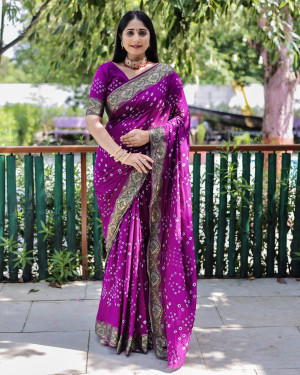 Magenta color pure hand bandhej silk saree with printed work