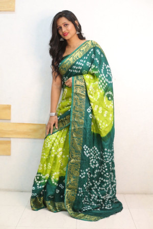 Parrot green and green color bandhej silk saree with zari weaving work