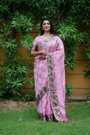 Baby pink color bandhej silk saree with zari weaving work